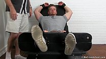 Restrained bodybuilder Ryan Sparks endures a fierce tickling