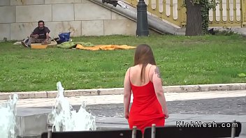 Busty slave bathing in fountain outdoor