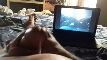 Handjob watching porn