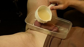 Boy cock encased in hot wax CBT