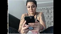 tattooed girl plays with her dildo