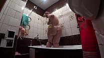 Behind the scenes, a hidden camera is spying on a fat porn model with a big ass in the bathroom.