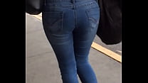 Beautiful ass in jeans walking down the street