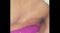 Squirting with purple dildo