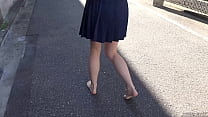 Girl walking outdoors barefoot