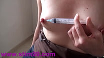 Squirting Saline by Nipple and Extreme Pierced