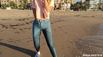 Wet shoot on a public beach with Crazy Model. Risky outdoor masturbation. Foot fetish. Pee in jeans.