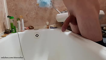 Russian teen pisses in the bathroom, jerks off his big cock and cums until his parents come back