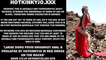 Large dong from mrHankey anal & prolapse by Hotkinkyjo in red dress on the rocks