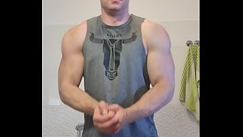 muscular guy is jerking off in laziness