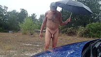 exhib under stormy rain with nipples clamps
