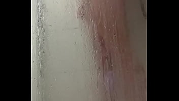 Young hairy man masturbates in the shower