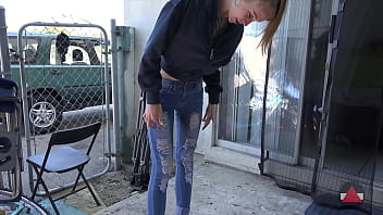 Skinny Girl in Tight Jeans Sucks Ice Pop