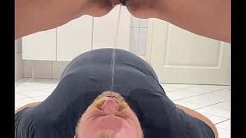 Mistress pissing in his mouth