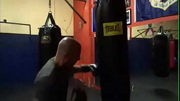 MAXXX LOADZ WORKING OUT ON HEAVY BAG WITH BOXING GLOVES ON STRIKING THE BAG