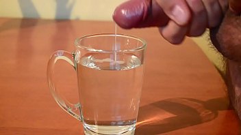 Cumming into glass of water