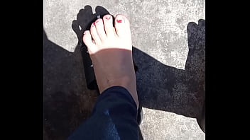 Feet in the sun before pedicure.